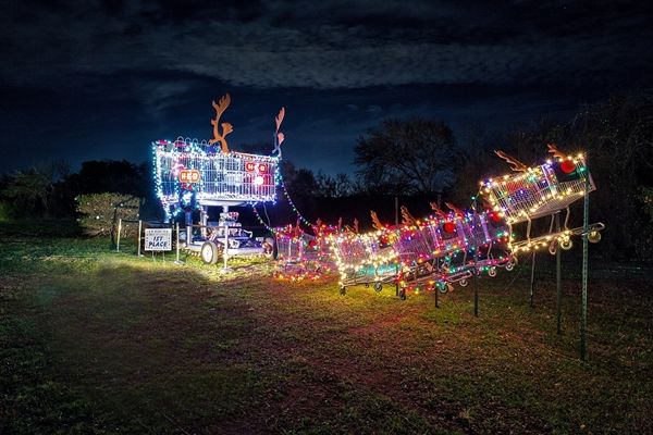 Holiday lights and lit up sleigh 